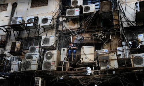 A man repairing air conditioners.