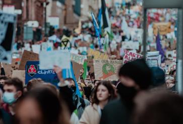 Climate march with people holding signs.