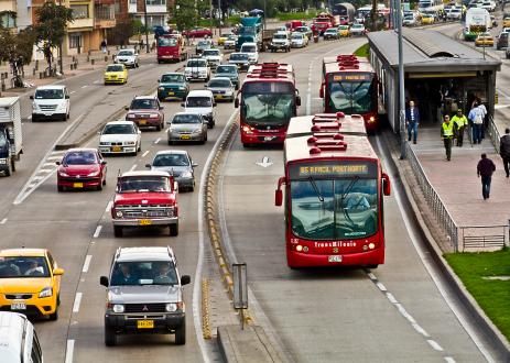 Electric bus on road with cars