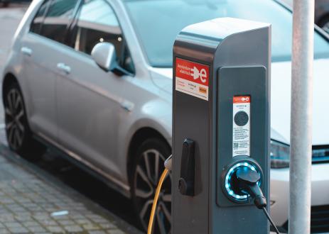 Electric vehicle charging at charging station