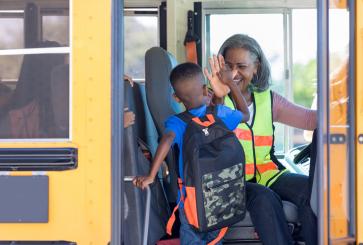 Child boarding school bus
