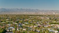 Wind ppwer behind the backdrop of a residential neighborhood in Palm Springs, CA