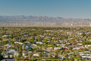Wind ppwer behind the backdrop of a residential neighborhood in Palm Springs, CA