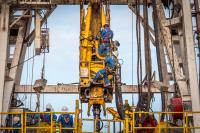 Workers on oil rig.