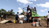 People load a truck with their belongings after heavy rainfall caused floods in Kenya.