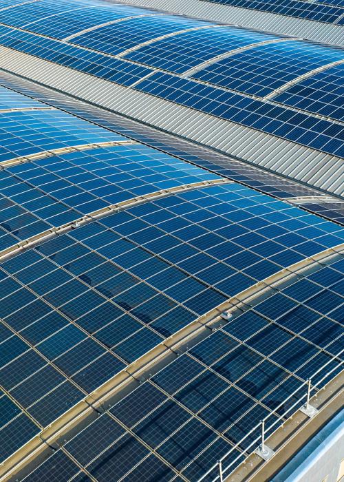 Large solar panels on roofs of industrial units and warehouses