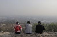 A group looks over a hazy Mexico City, Mexico, from the top of Cerro de la Estrella in April 2021. Days earlier, the city registered an ozone concentration of 160 parts per billion.