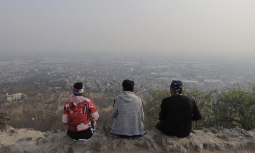 A group looks over a hazy Mexico City, Mexico, from the top of Cerro de la Estrella in April 2021. Days earlier, the city registered an ozone concentration of 160 parts per billion.