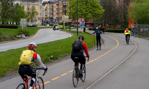 Bicyclists ride on separated roadways in Oslo.