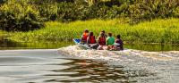 People in a boat on the Revantazon River in Costa Rica.