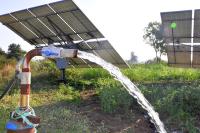 Water pump in front of solar panels.