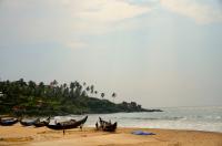 People in boats on the beach.